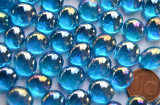 Mini Glasnuggets 10-12mm blau irisierend transp. 70g ca.50 St. Mini Glasnuggets 10-12mm blau irisierend transp. 70g ca.50 St.